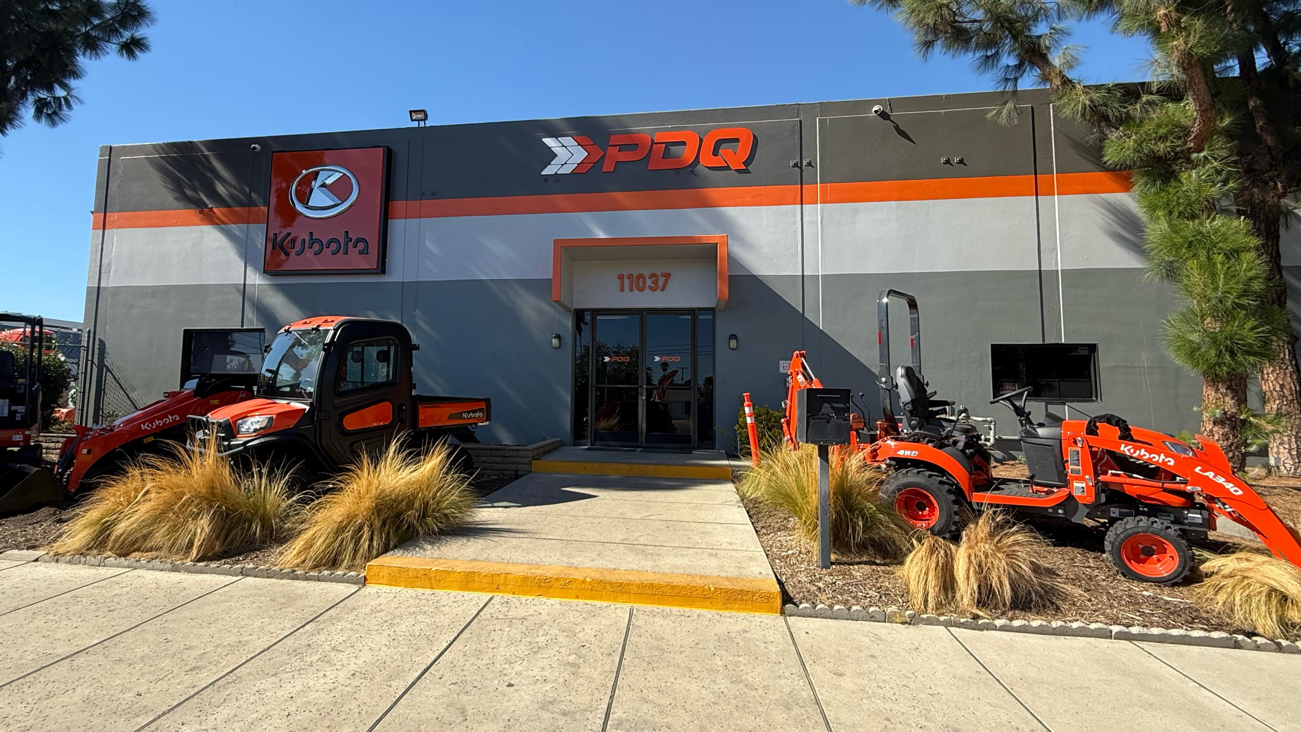 The Kubota of Los Angeles storefront with Kubota machines parked out front