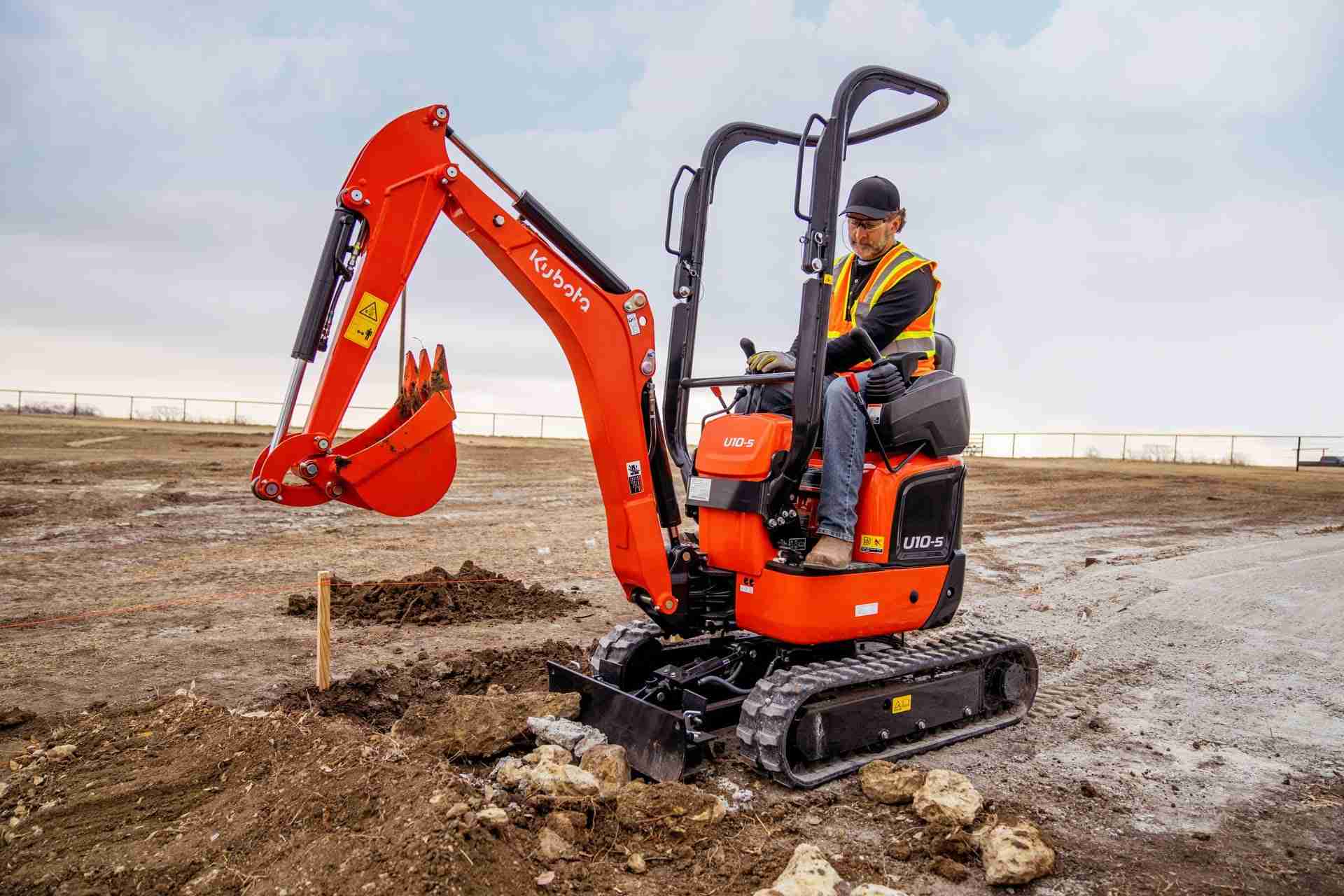 Operator digging with a small Kubota U10 micro excavator